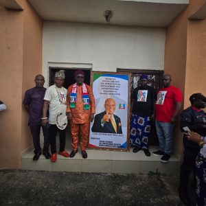 Barr. Kufre Udosen and Annang youths displaying Gov Eno's portrait - Straightnews