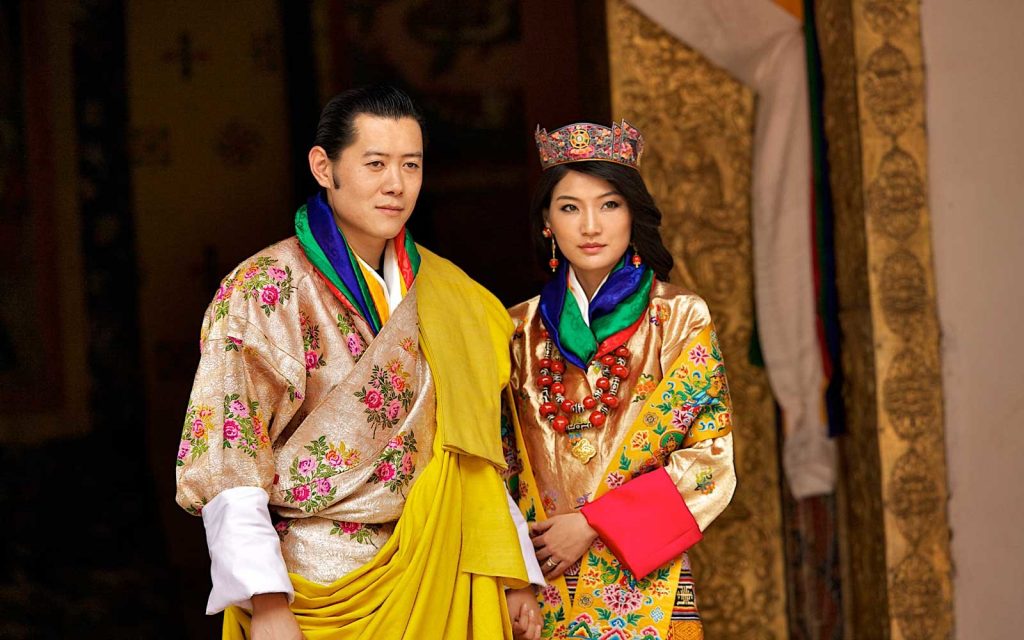 PARO, BHUTAN - OCTOBER 13: His majesty King Jigme Khesar Namgyel Wangchuck, 31, and Queen Jetsun Pema, 21, walk out after their marriage ceremony is completed on October 13, 2011 in Punakha, Bhutan. The popular Oxford-educated king's ceremony will be followed by celebration in the capital and countryside. (Photo by Triston Yeo/Getty Images)