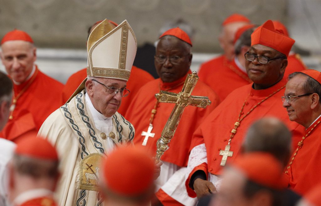 Pope Francis in the midst of Cardinals