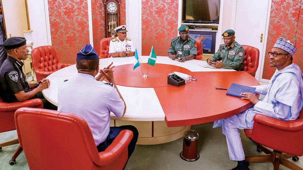 President Muhammadu Buhari (right) and the Service Chiefs during a special meeting in his office at the State House, Abuja straightnews