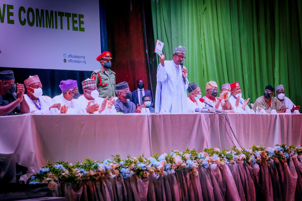 President Muhammadu Buhari displaying the APC forms at NEC meeting- Straightnews