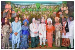 Pastor Umo Eno wearing agbada, and wife together with the couple- Straightnews