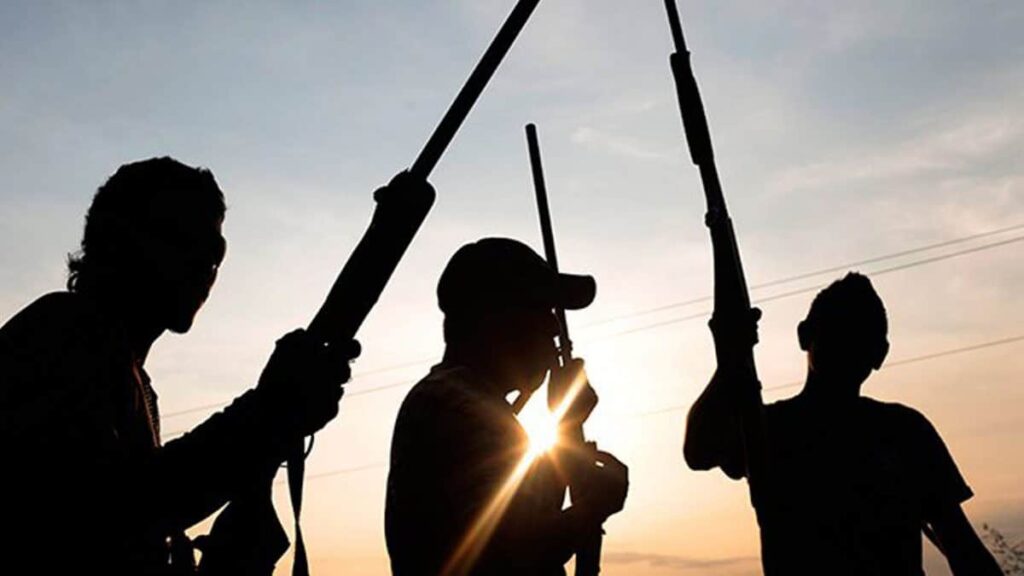 Gunmen displaying guns- straightnews