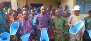 Amos Udom and others clutching the SaTo toilet pans - Straightnews