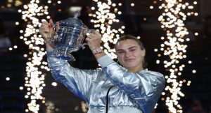 Belarus’s Aryna Sabalenka poses with the trophy - Straightnews