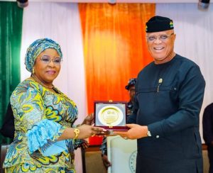 Mrs Watson-Jackson receiving a plaque from Gov Eno - Straightnews