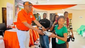 Mr Ernest Awakessien presenting the seedling to a farmer - Straightnews